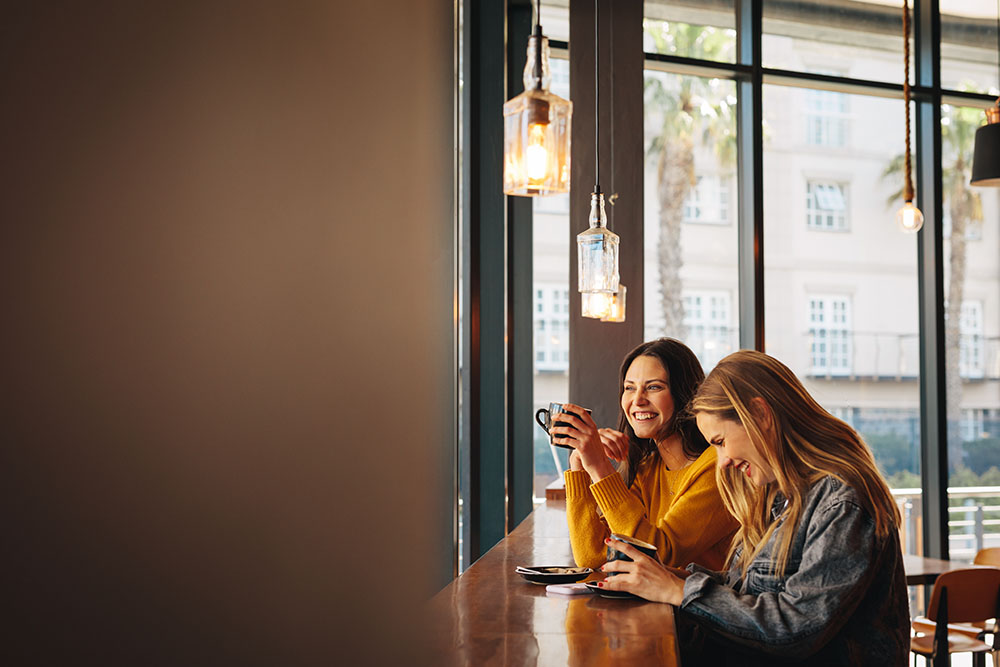 Two people enjoying a relaxed conversation over coffee